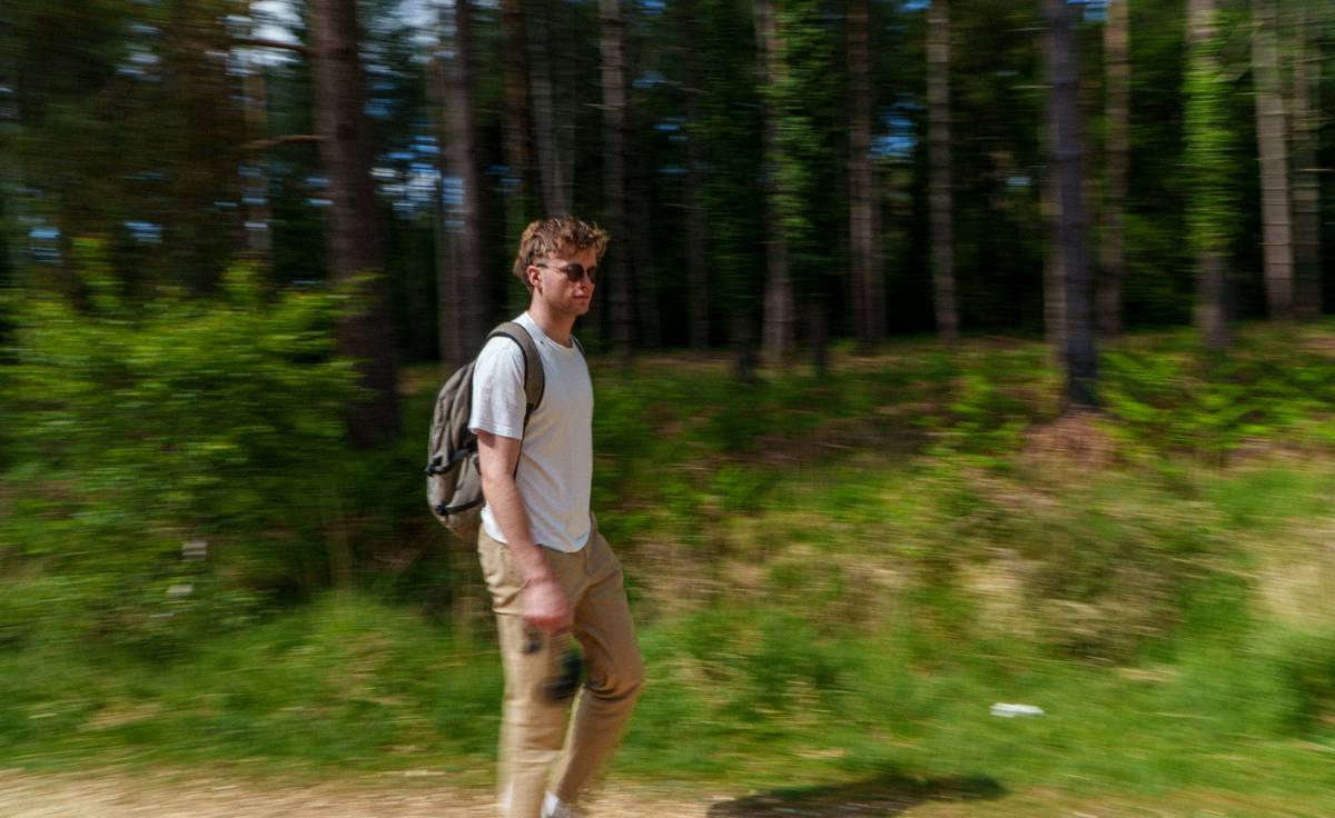 A backpack filled with essentials like water bottles, snacks, and a map.
