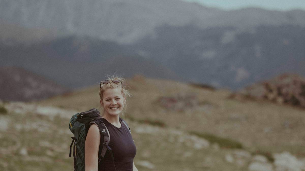Before-and-after photo of a hiker showing significant weight loss over six months