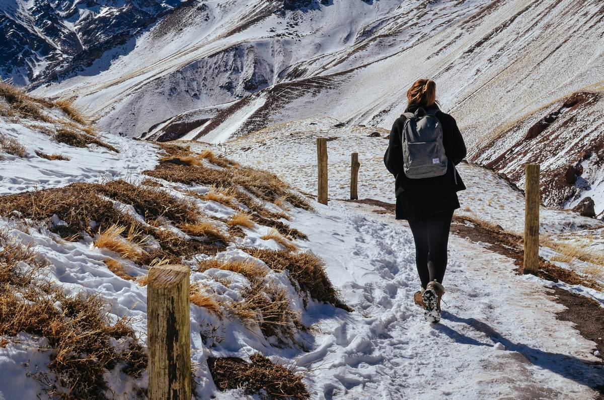 Close-up of hiking boots, backpack, and water bottle ready for a hike