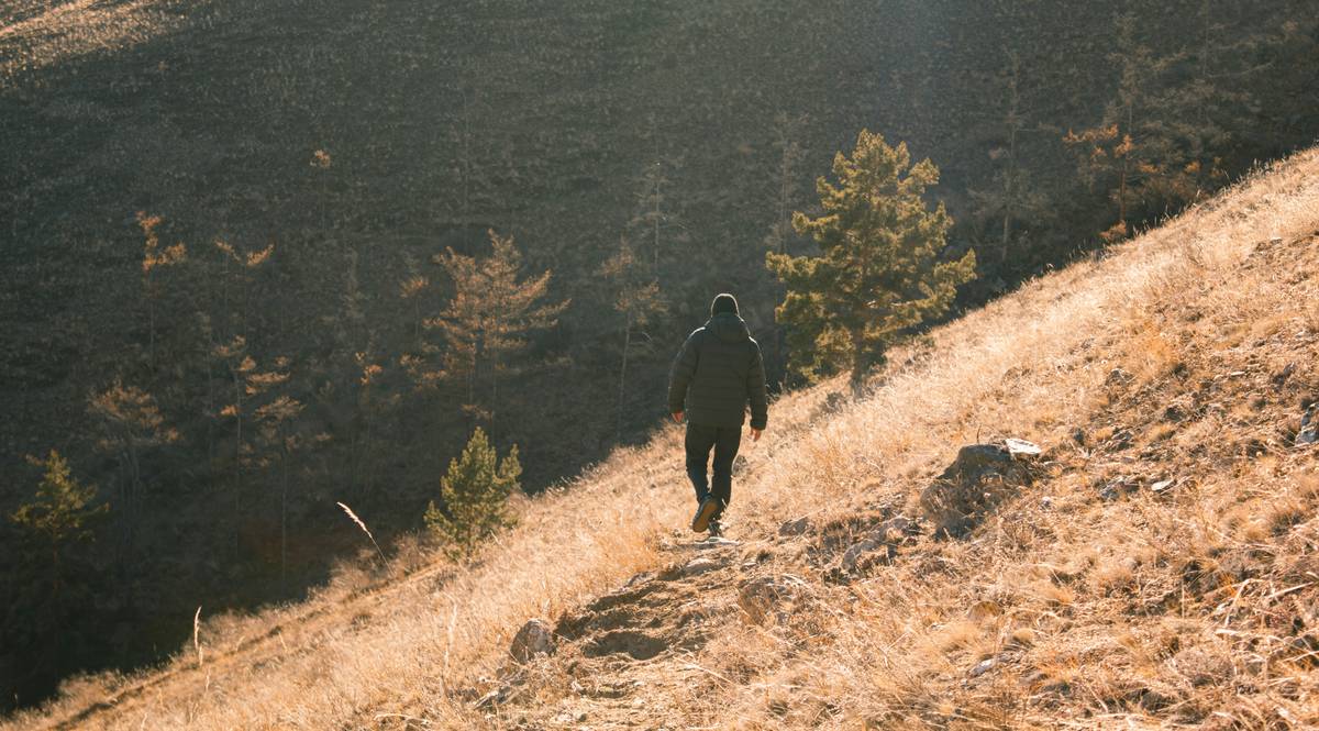 Close-up shot of durable hiking boots resting on rocky ground.