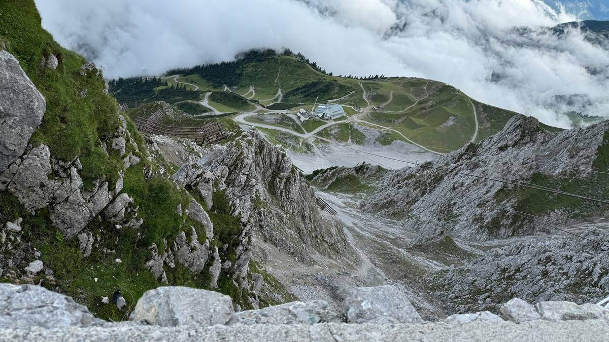 Photo of Tara celebrating reaching a mountain summit