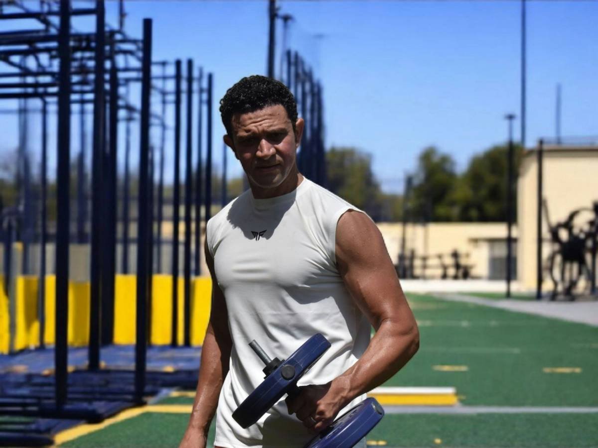 A person standing triumphantly atop a mountain after a long hike
