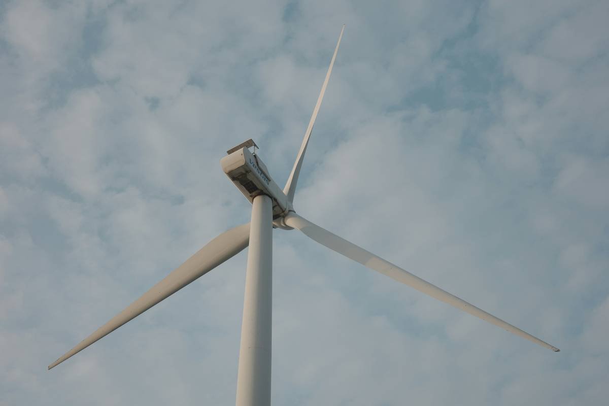 The wind turbines stand in the valley. Like giants towering above, we feel tiny beneath them,steadfast and peaceful all at once.oment here blends natural beauty with timeless tranquility